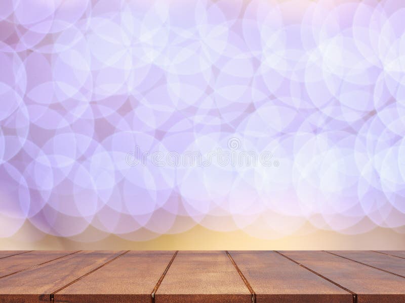 Empty wooden table top with abstract blurred lighting background stock images