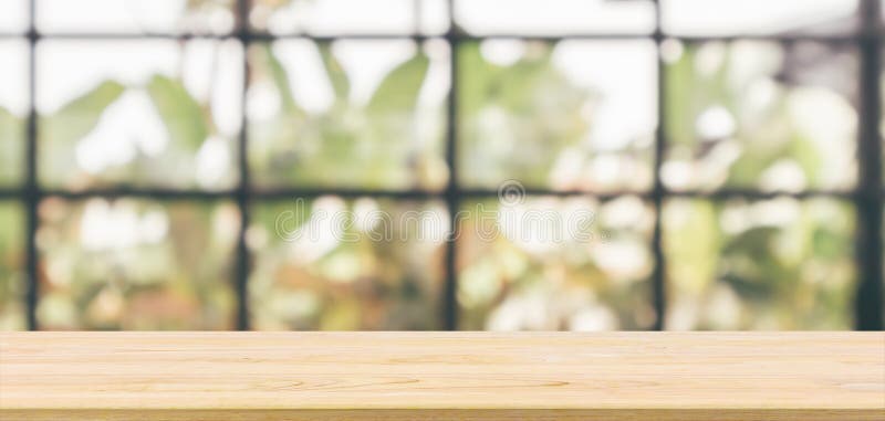 Empty wooden table top with cafe restaurant background