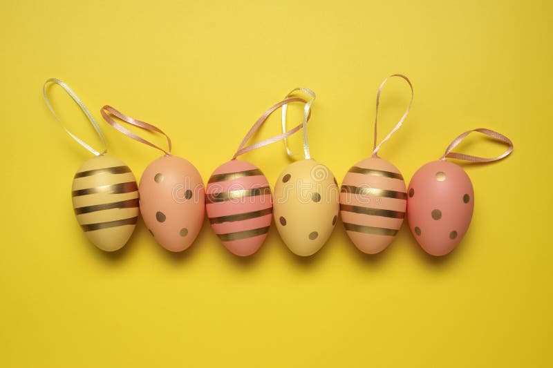 Empty yellow background with Easter eggs stock image