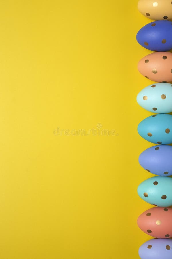 Empty yellow background with Easter eggs stock image