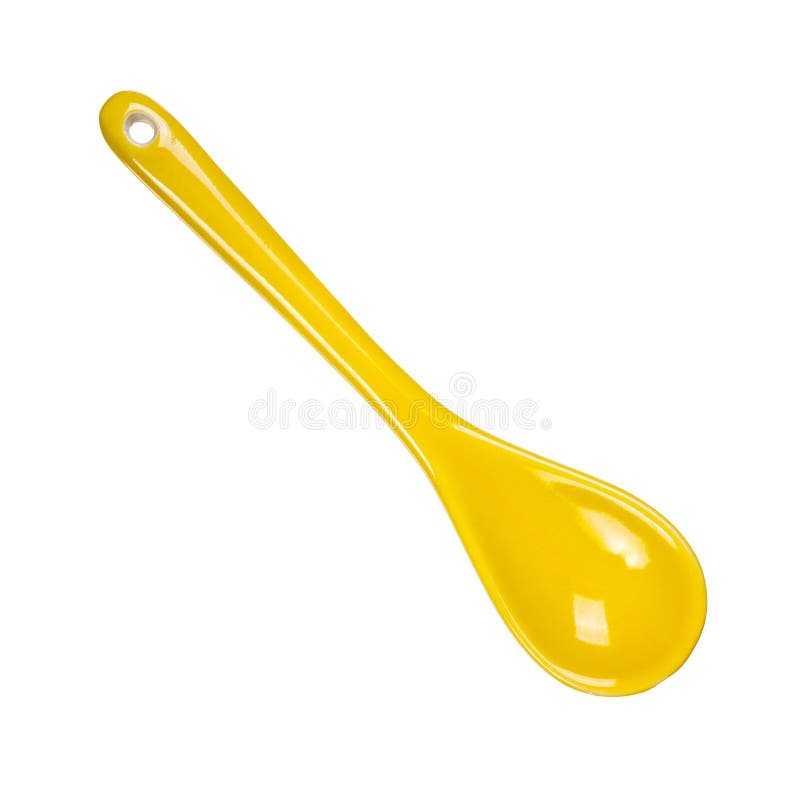 Empty yellow ceramic spoon stock photography