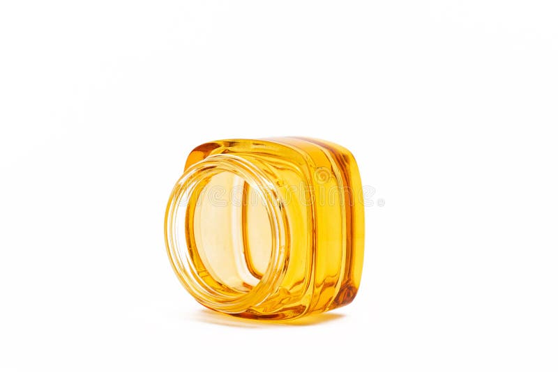 Empty yellow glass jar stock image