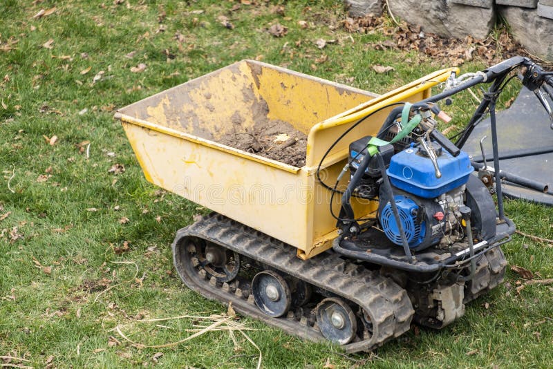 Empty Yellow Power Wheelbarrow royalty free stock photography