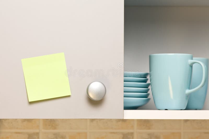 Empty yellow sticker on cabinet door royalty free stock image