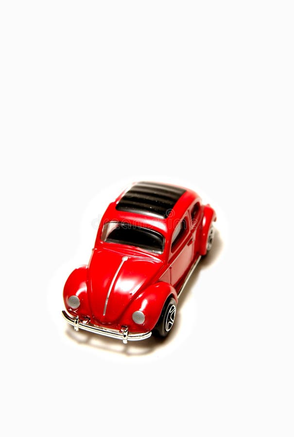 Red sedan matchbox toy car on white background. Red sedan matchbox toy car on white background.