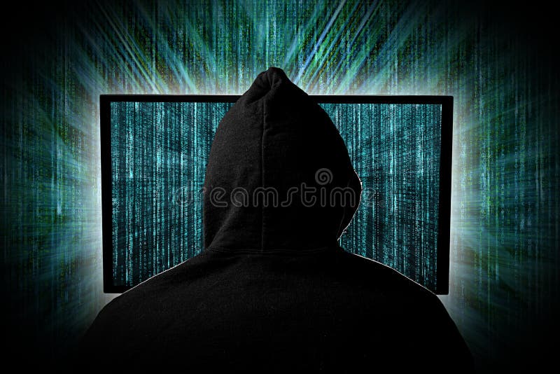 En hacker bak glödande datorbildskärmskärm framme av den gröna datoren för hacka för cyber för internet för bakgrund för arkivfoto En hacker bak glödande datorbildskärmskärm framme av den gröna datoren för hacka för cyber för internet för bakgrund för arkivfoto