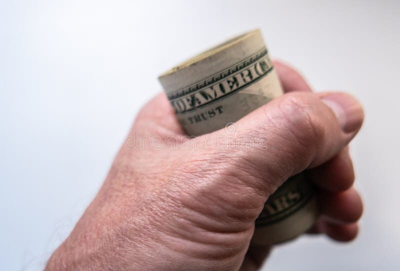 En hand håller dollar royaltyfri fotografi En hand håller dollar royaltyfri fotografi