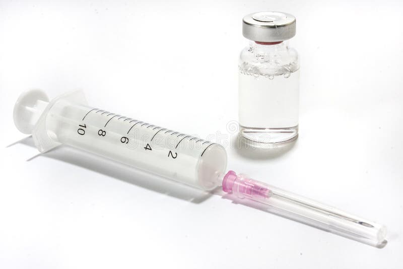En injektionsspruta med en visare och en vaccin fotografering för bildbyråer En injektionsspruta med en visare och en vaccin fotografering för bildbyråer