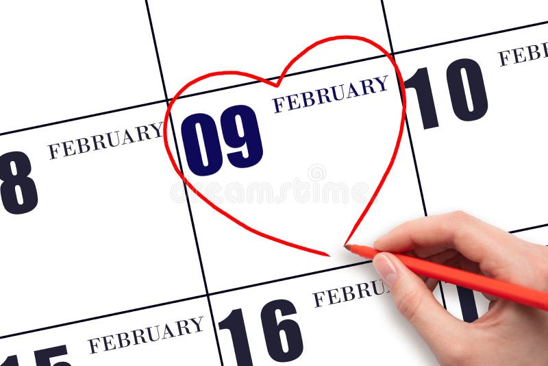 9th day of February. A woman&#x27;s hand drawing a red heart shape on the calendar date of 9 February. Heart as a symbol of love. Winter month. Day of the year concept. 9th day of February. A woman&#x27;s hand drawing a red heart shape on the calendar date of 9 February. Heart as a symbol of love. Winter month. Day of the year concept