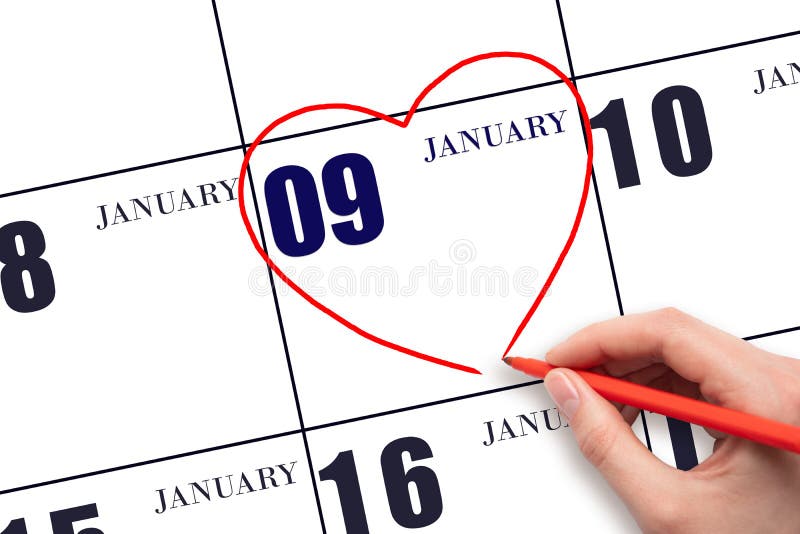 9th day of January. A woman&#x27;s hand drawing a red heart shape on the calendar date of 9 January. Heart as a symbol of love. Winter month. Day of the year concept. 9th day of January. A woman&#x27;s hand drawing a red heart shape on the calendar date of 9 January. Heart as a symbol of love. Winter month. Day of the year concept