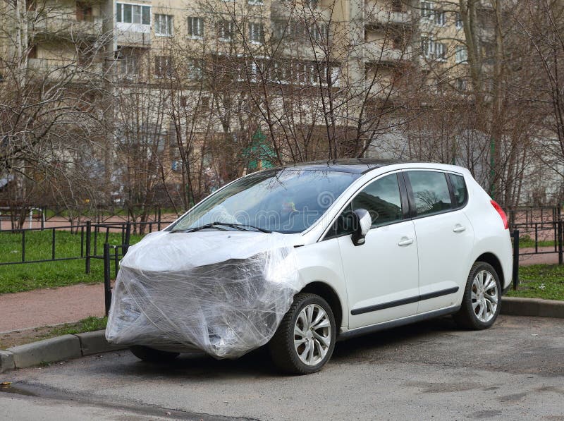 A new white wrecked car after an accident is covered with plastic wrap, Bolshevik Prospect, Saint Petersburg, Russia, March 26, 2024. A new white wrecked car after an accident is covered with plastic wrap, Bolshevik Prospect, Saint Petersburg, Russia, March 26, 2024