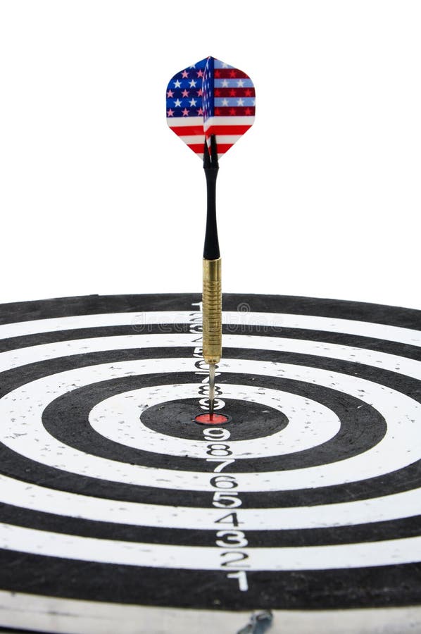 A dart with USA flag on the fletching in the center circle of a target. A dart with USA flag on the fletching in the center circle of a target