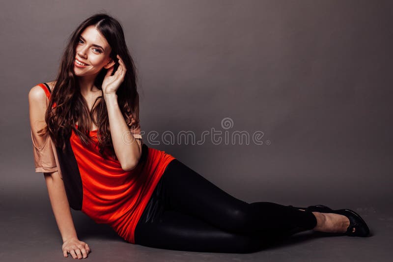 Beautiful girl with long hair sitting on the floor 1. Beautiful girl with long hair sitting on the floor 1