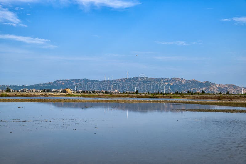 A road piled up on saline alkali land, a salt pond. A road piled up on saline alkali land, a salt pond.