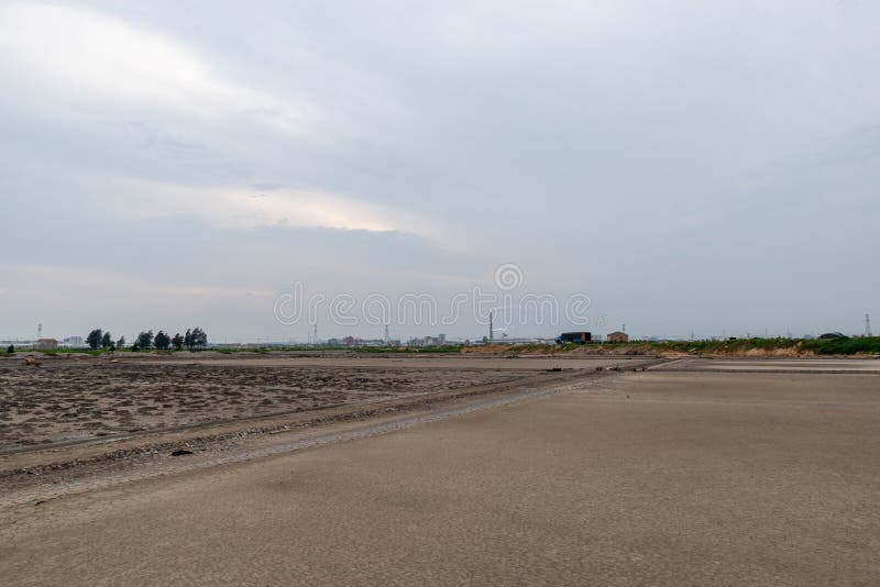 A road piled up on saline alkali land, a salt pond. A road piled up on saline alkali land, a salt pond.