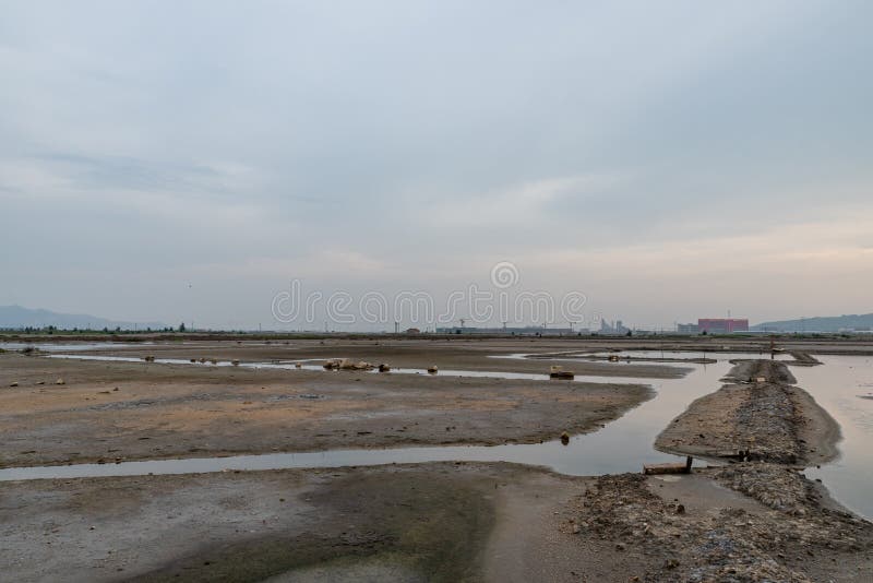 A road piled up on saline alkali land, a salt pond. A road piled up on saline alkali land, a salt pond.