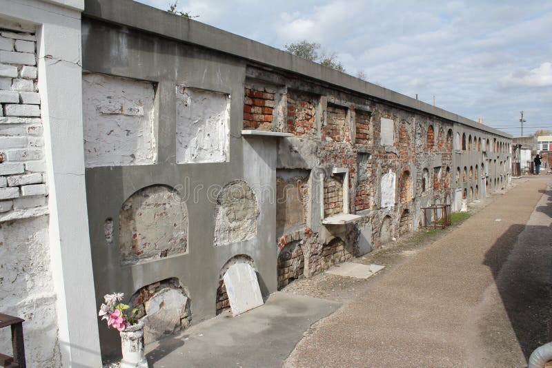 A wall of very old and deteriorating so-called oven crypts at the St. Louis Cemetery #1 in New Orleans, Louisiana. A wall of very old and deteriorating so-called oven crypts at the St. Louis Cemetery #1 in New Orleans, Louisiana