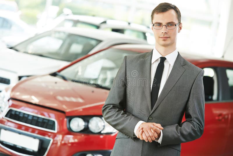 Portrait og salesperson or manager of car automobile dealer welcoming with open arms. Portrait og salesperson or manager of car automobile dealer welcoming with open arms