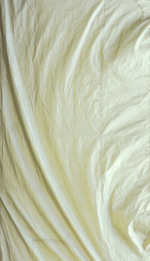 White tarpaulin with swirls and corner creases textured background. White tarpaulin with swirls and corner creases textured background