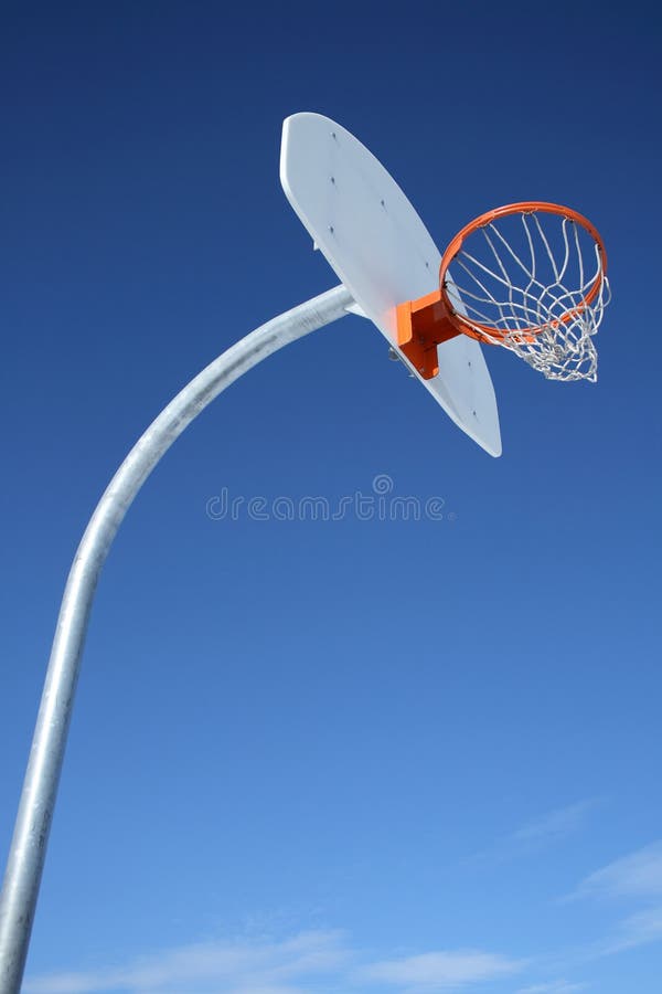 New basketball backboard and clear sky. Perfect day for playing basketball. New basketball backboard and clear sky. Perfect day for playing basketball.