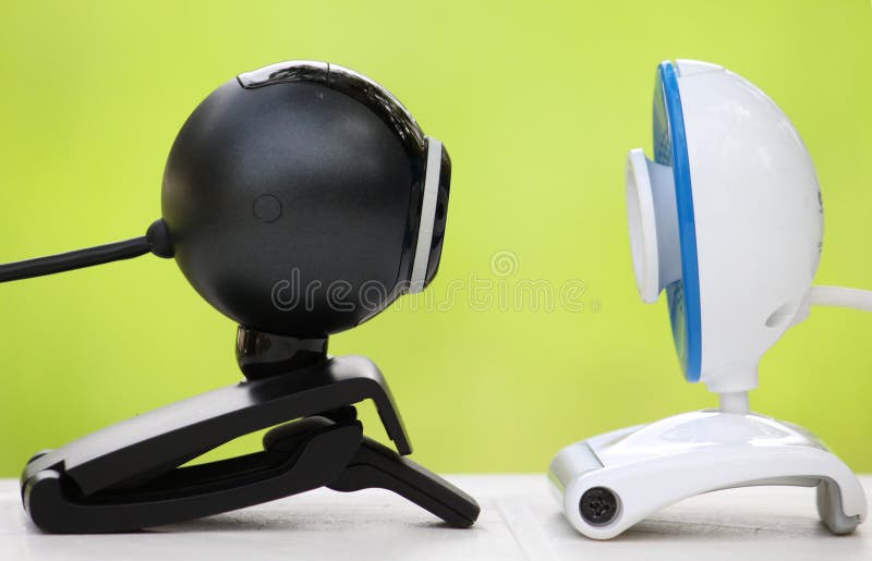 Close-up of two web cameras facing each other. Close-up of two web cameras facing each other