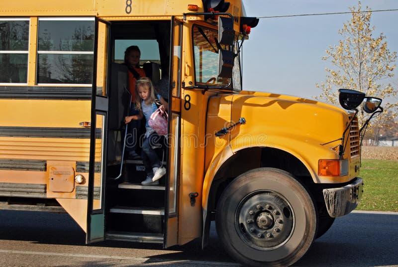 young girl on school bus
