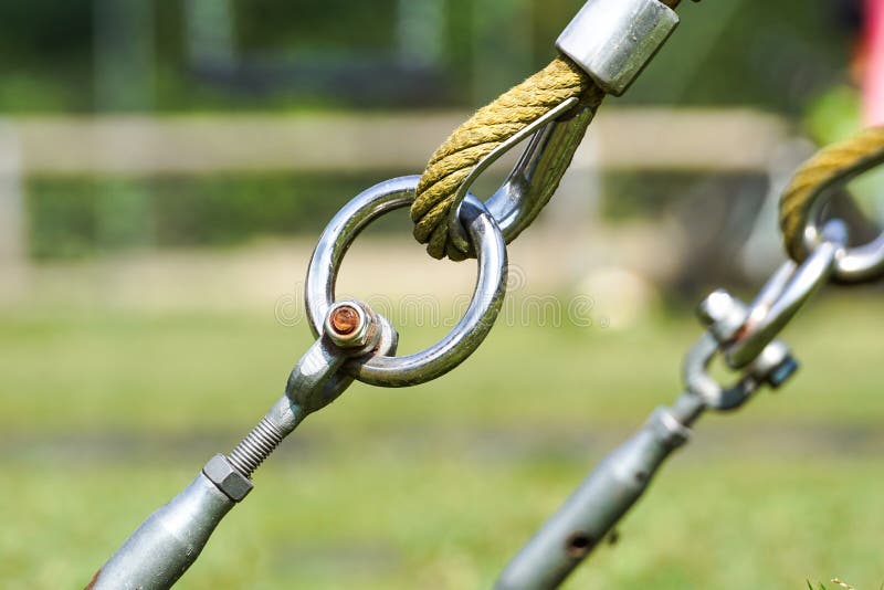 End of Swinging Rope Hang on Metal Construction in a Park. Rough Rope End  in Metal Circles and Safety Snap Hook Stock Image - Image of colorful,  ring: 100187783