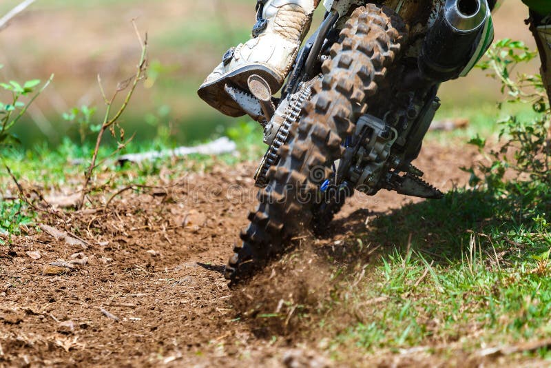 Enduro,motocross in the mud,Details of flying debris during an acceleration