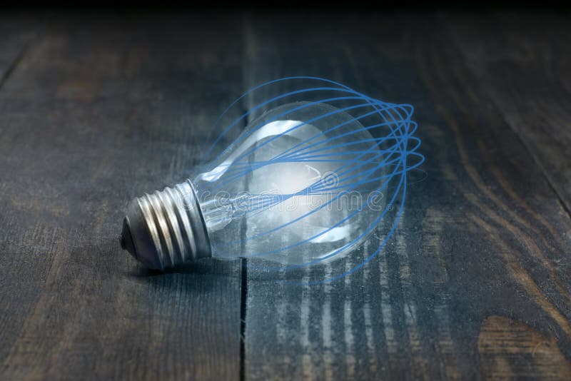 Energiteknologin av en ljus kula som isoleras från blåa krökta linjer och skönheten av träbrädefibrer arkivbilder Energiteknologin av en ljus kula som isoleras från blåa krökta linjer och skönheten av träbrädefibrer arkivbilder