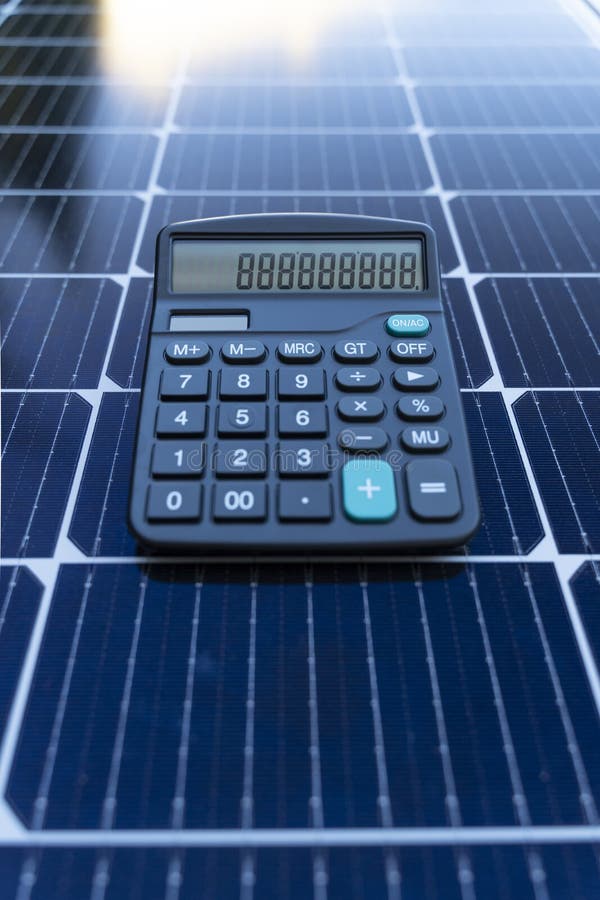 Energy Saving Concept with Solar Panels and a Calculator Stock Image ...