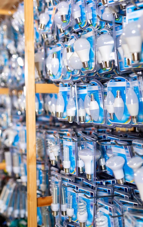 Energy Saving Lamps on Shelves of an Electrical Goods Store Stock Photo