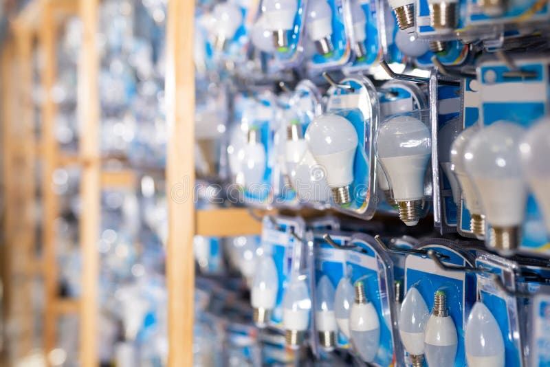 Energy Saving Lamps on Shelves of an Electrical Goods Store Stock Photo