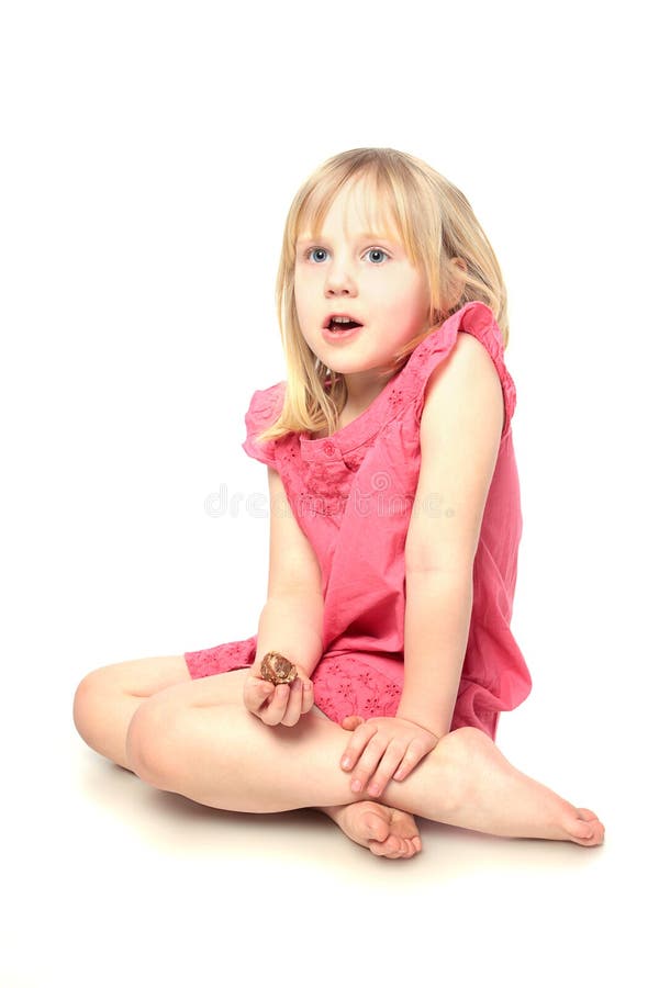Enfant avec la sucrerie sur le blanc image stock Enfant avec la sucrerie sur le blanc image stock