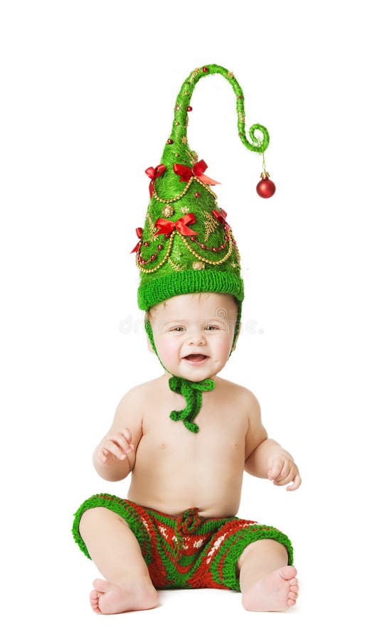 Enfant de bébé de Noël dans la décoration verte de chapeau en tant qu'enfant d'arbre de Noël photographie stock libre de droits Enfant de bébé de Noël dans la décoration verte de chapeau en tant qu'enfant d'arbre de Noël photographie stock libre de droits