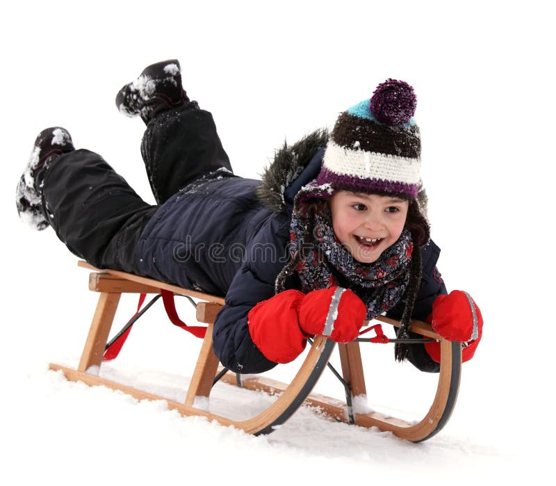 Enfant heureux sur le traîneau en hiver photos libres de droits Enfant heureux sur le traîneau en hiver photos libres de droits