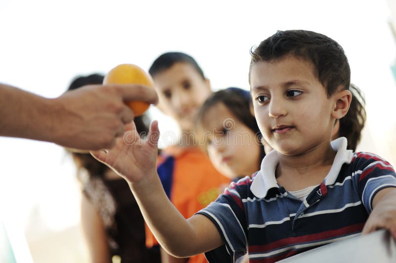 Hungry children in refugee camp, distribution of humenitarian food. Hungry children in refugee camp, distribution of humenitarian food