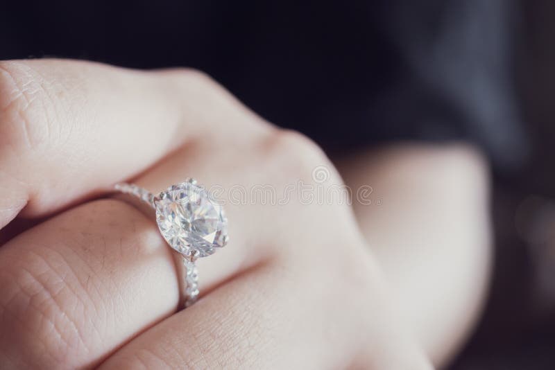 Engagement diamond ring on woman finger closeup royalty free stock photo Engagement diamond ring on woman finger closeup royalty free stock photo