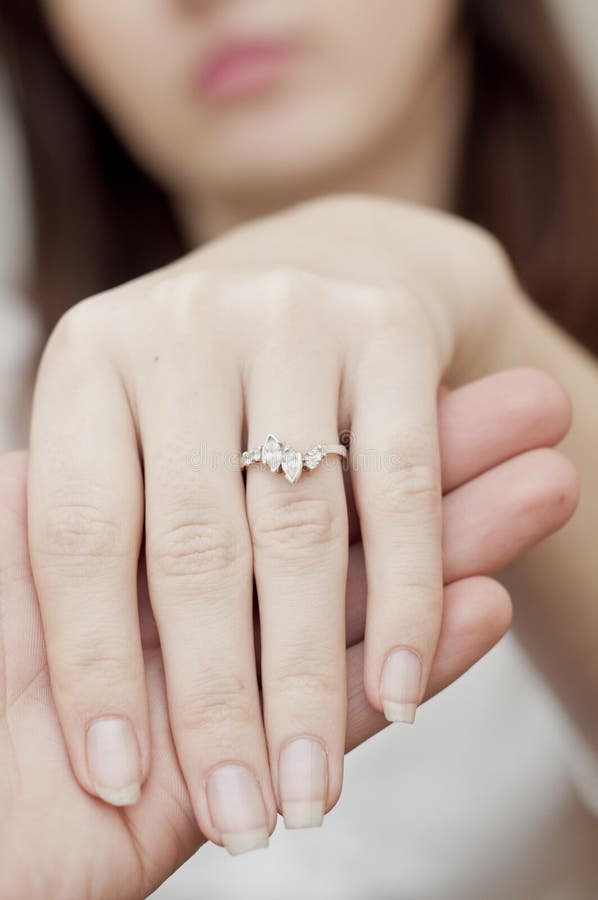 Engagement Ring Into A Finger Stock Photo 