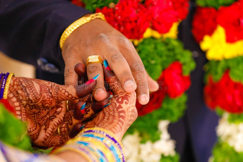 Image of Wedding couple wearing rings to each other in ring Ceremony -NT151137-Picxy