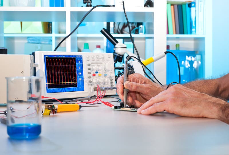 An engeneer tests electronic components royalty free stock photos
