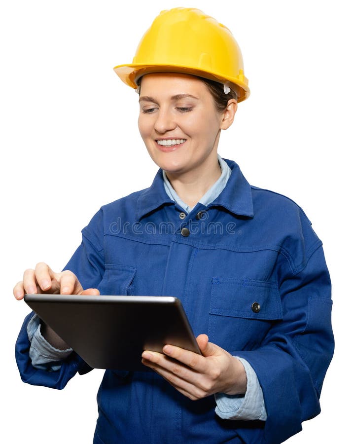 Engenheira sorridente isolada de capacete amarelo e uniforme azul com tablet digital fotografia de stock