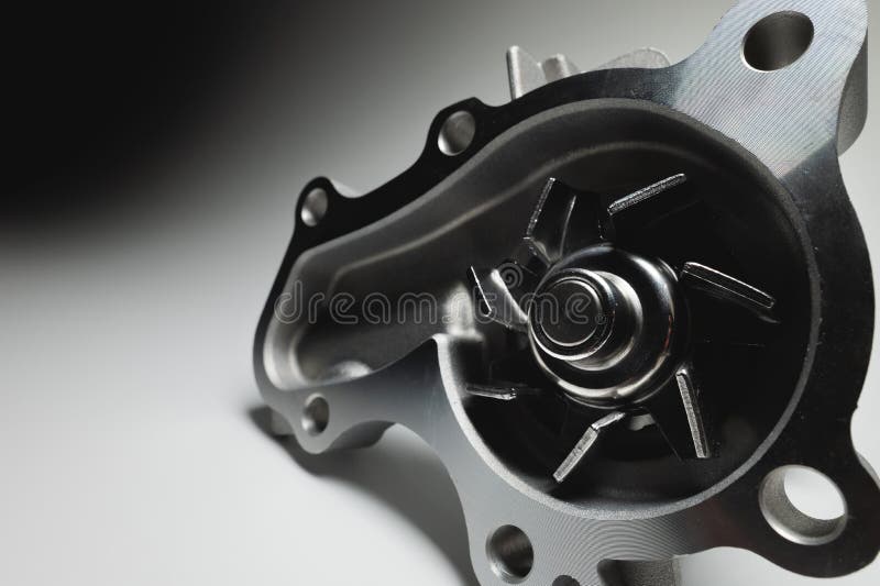 Car Engine Coolant Water Pump New on a Gray Background. Spare Parts