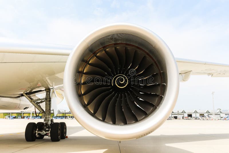 Engine of modern passenger jet airplane. Rotating fan and turbine blades