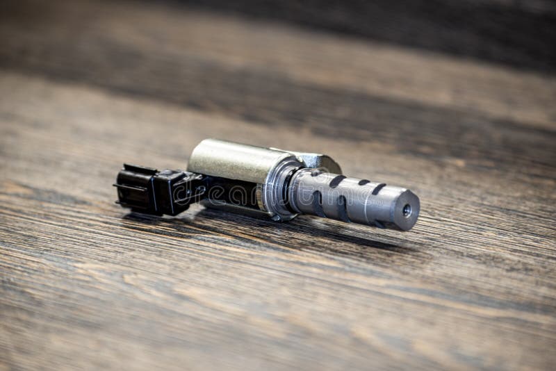 Engine VVTI valve on wooden background