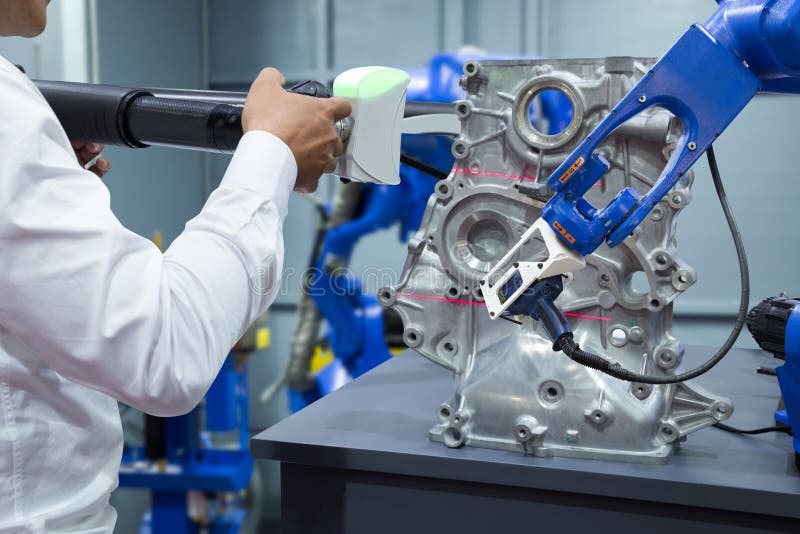 Engineer and assistant robot working with 3D portable measuring stock photos