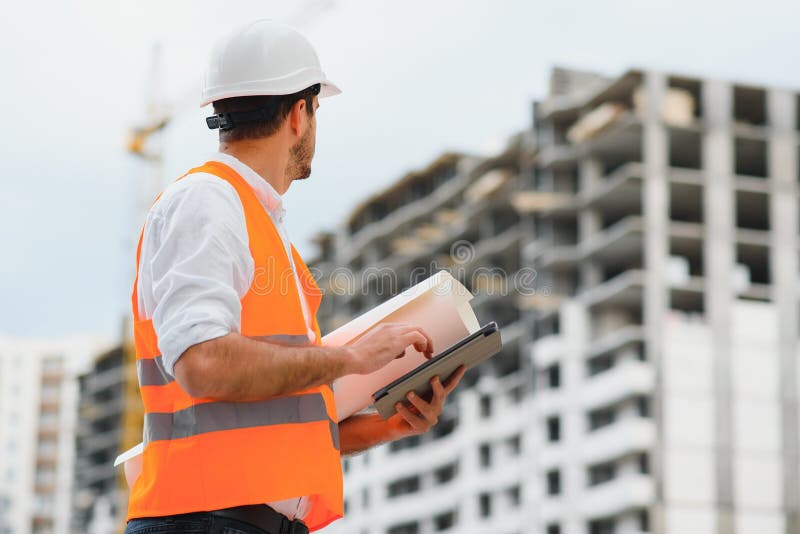 Engineer Builder Wearing Safety Vest with Blueprint at Construction Site Stock Image Image of