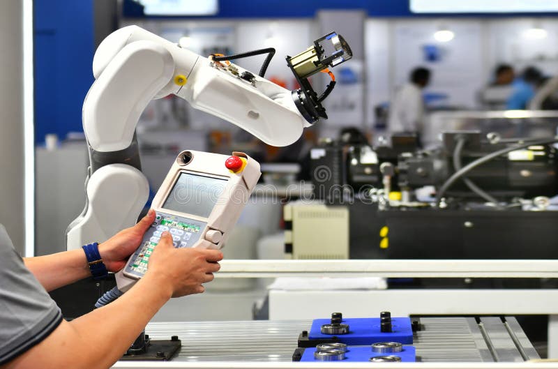 Engineer check and control automation Robot arm stock photography Engineer check and control automation Robot arm stock photography