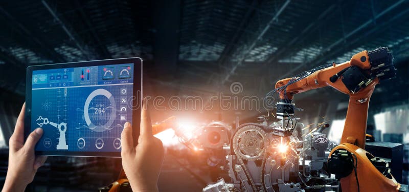 Engineer check and control welding robotics automatic arms machine in intelligent factory automotive.