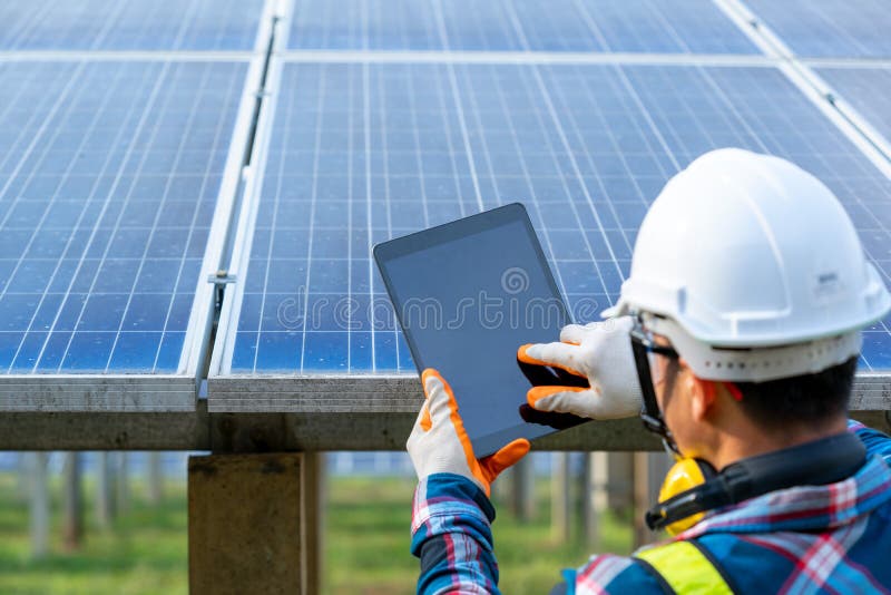 Engineer Checking Solar Panel in Routine Operation at Solar Power Plant