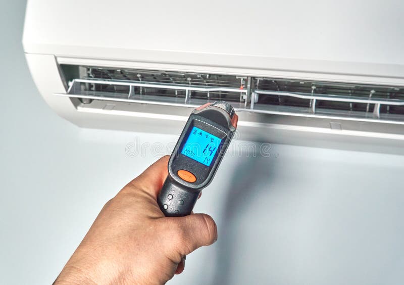 Engineer Checking Temperature by Infrared Thermometer Inside of Air